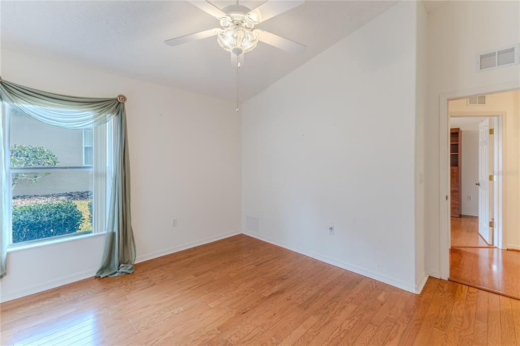239 Longleaf Court Spring Hill, FL 34609 - Photo 32 of 55 a view of empty room with wooden floor and fan