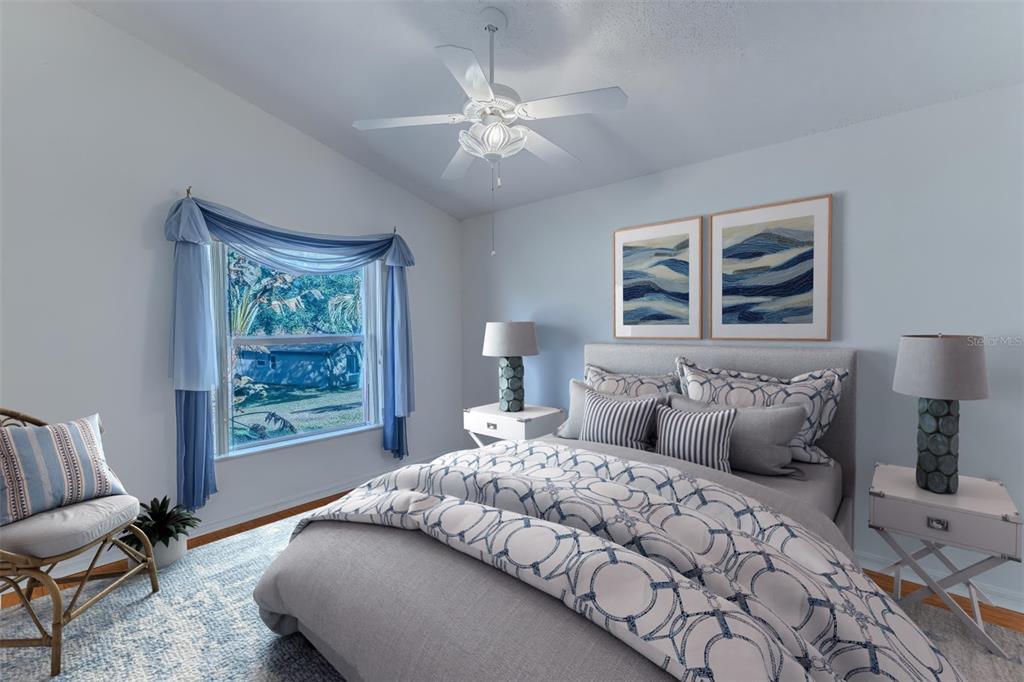 239 Longleaf Court Spring Hill, FL 34609 - Photo 34 of 55 a bedroom with a large bed and a window