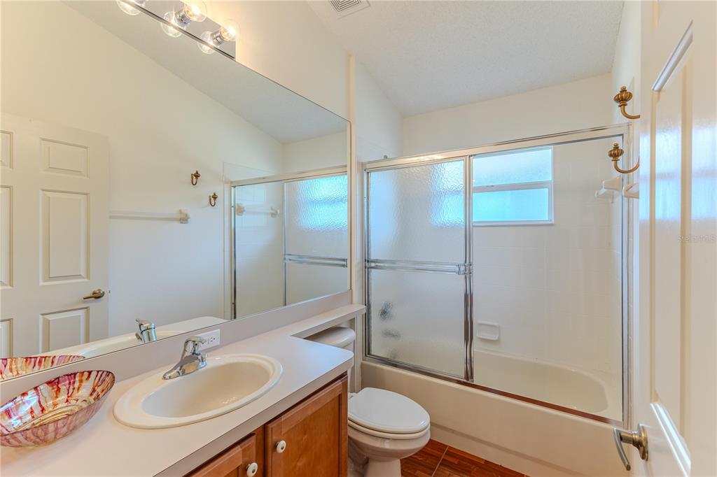 239 Longleaf Court Spring Hill, FL 34609 - Photo 36 of 55 a bathroom with a sink toilet and shower