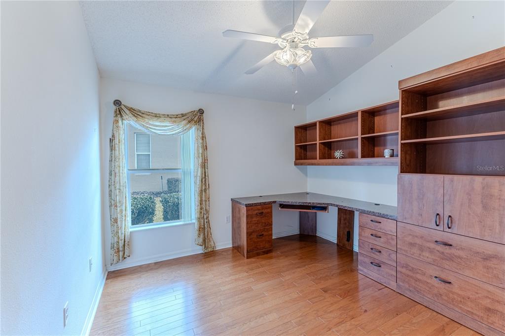 239 Longleaf Court Spring Hill, FL 34609 - Photo 38 of 55 a view of workspace with wooden floor and cabinet