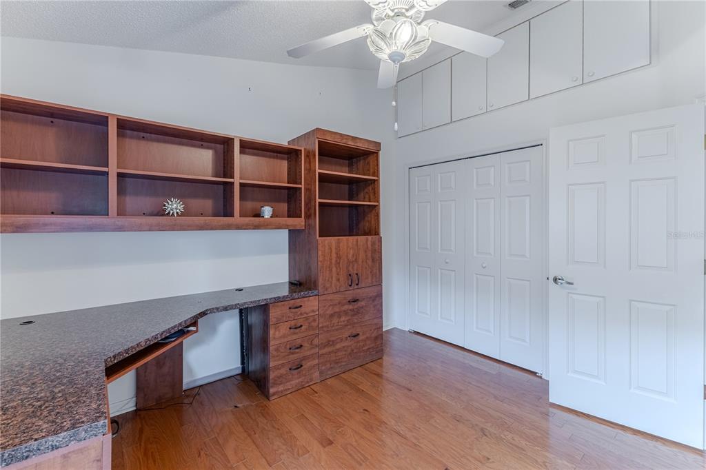 239 Longleaf Court Spring Hill, FL 34609 - Photo 40 of 55 a room with furniture and wooden floor