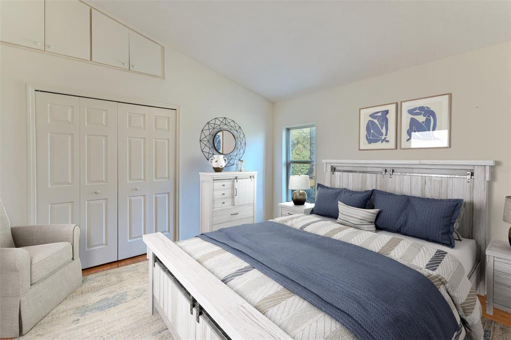 239 Longleaf Court Spring Hill, FL 34609 - Photo 42 of 55 a bedroom with a bed and a couch