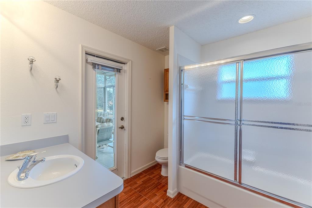 239 Longleaf Court Spring Hill, FL 34609 - Photo 43 of 55 a bathroom with a sink and shower