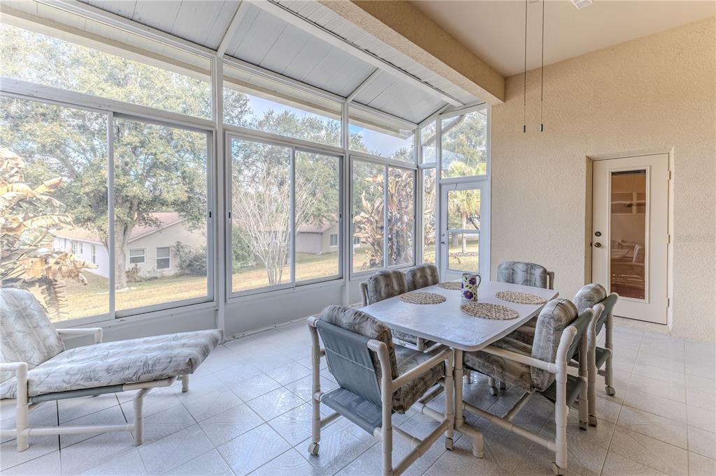 239 Longleaf Court Spring Hill, FL 34609 - Photo 50 of 55 a view of a dining room with furniture and window