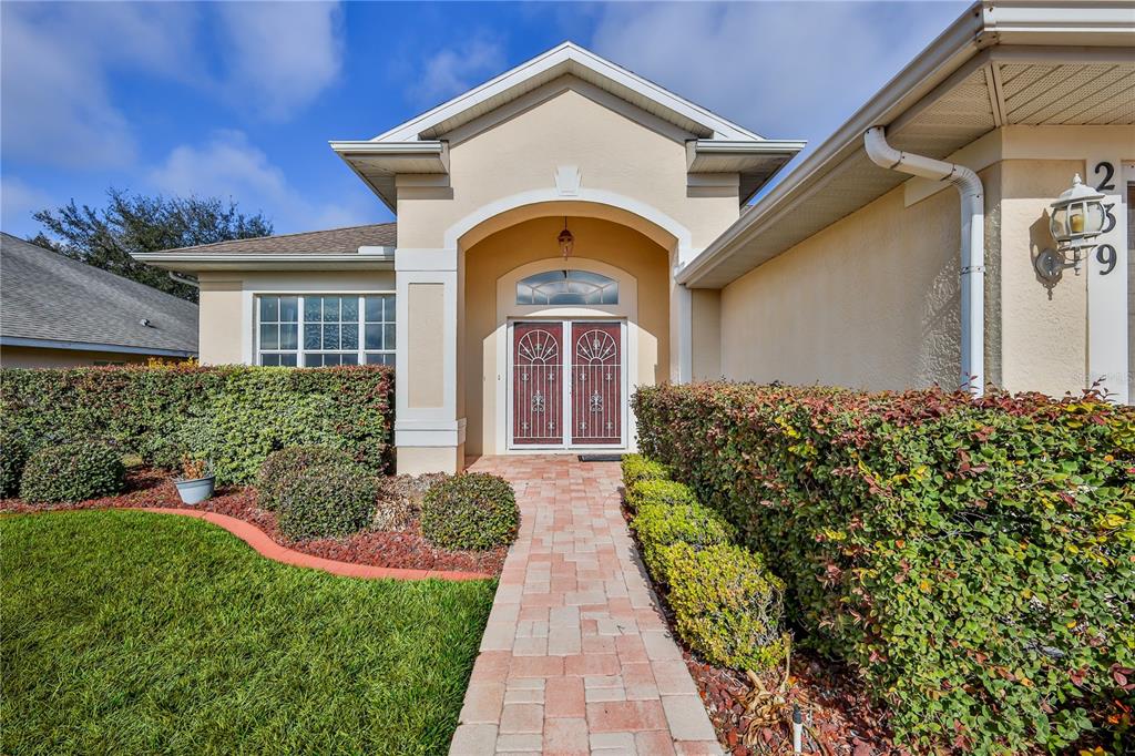 239 Longleaf Court Spring Hill, FL 34609 - Photo 5 of 55 a front view of a house with a yard