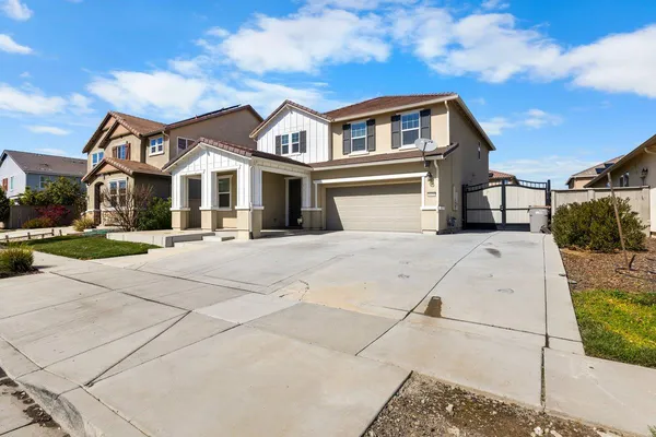 a view of a white house with a large windows