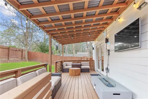 a view of roof deck with patio