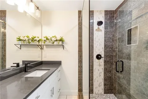 a bathroom with a sink and mirror