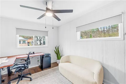 a view of a livingroom with furniture and wooden floor