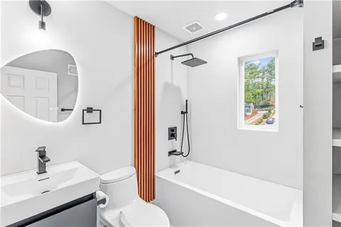 a bathroom with a bathtub and a shower