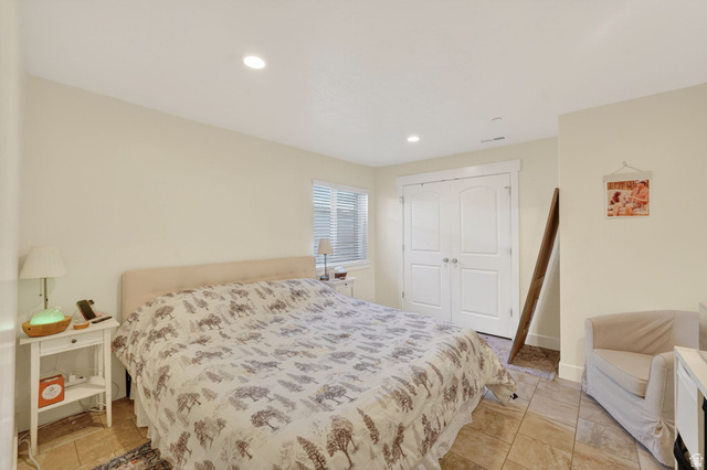 141 Wolverine Creek Elk Ridge, UT 84651 - Photo 28 of 47 Bedroom featuring a closet, recessed lighting, and light tile patterned flooring