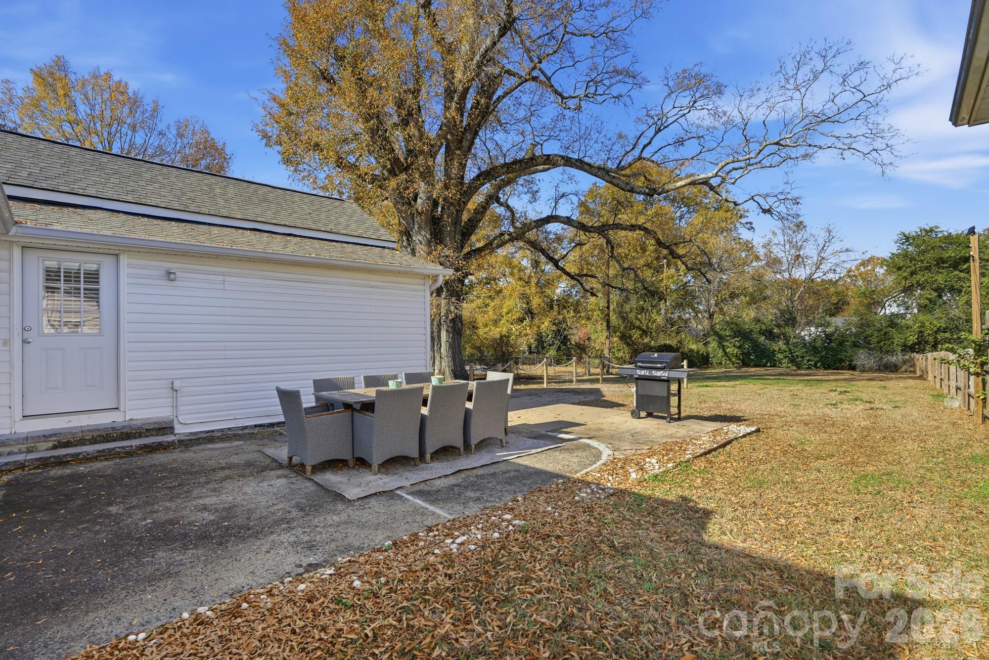128 Massey Street Fort Mill, SC 29715 - Photo 20 of 29 a backyard of a house with table and chairs