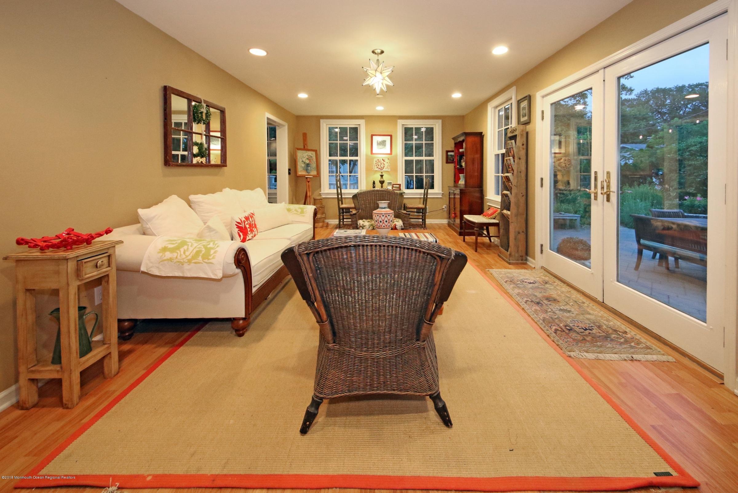 668 River Road Fair Haven, NJ 07704 - Photo 14 of 68 a living room with hard wood flooring furniture and a table