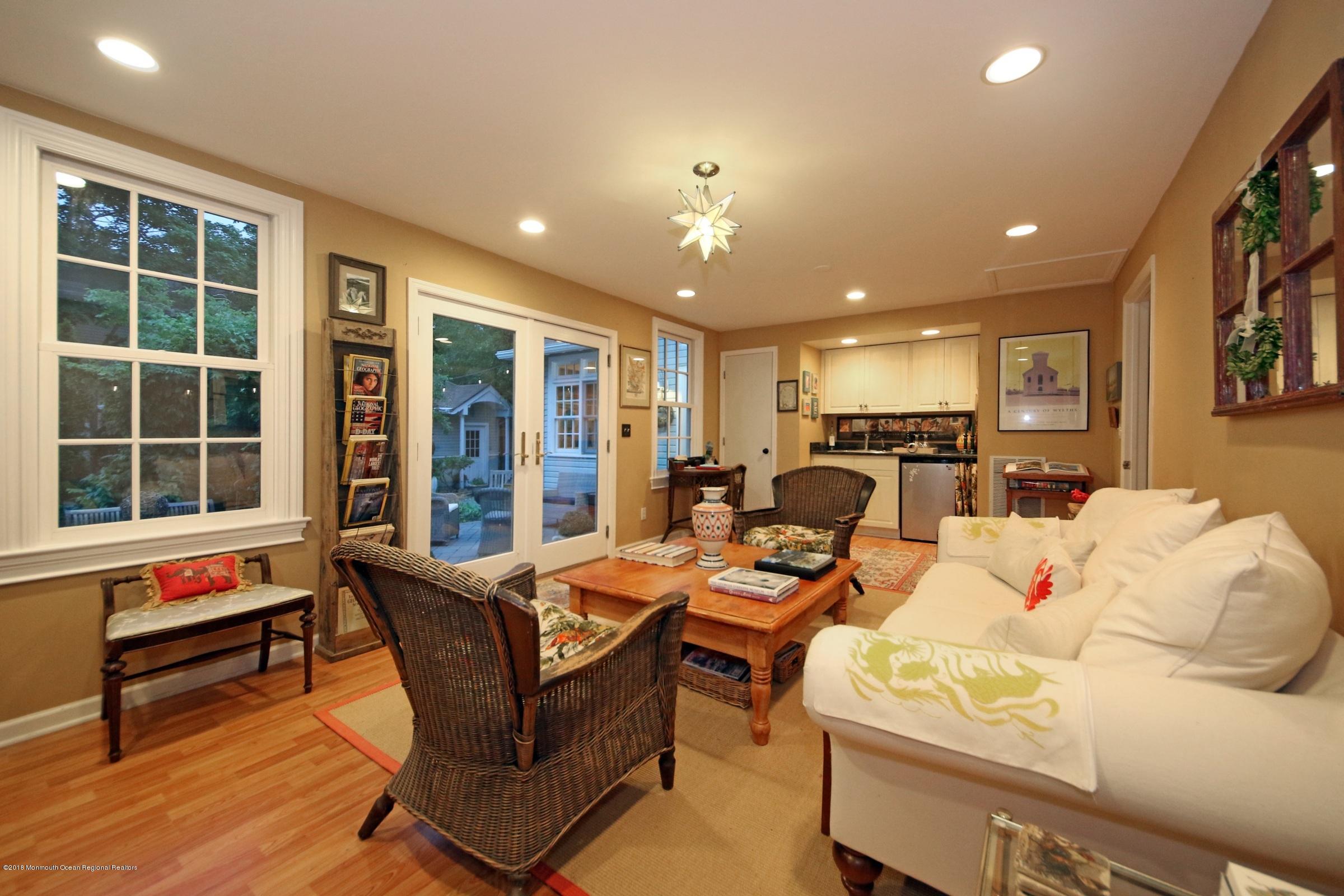 668 River Road Fair Haven, NJ 07704 - Photo 15 of 68 a living room with furniture a window and a flat screen tv