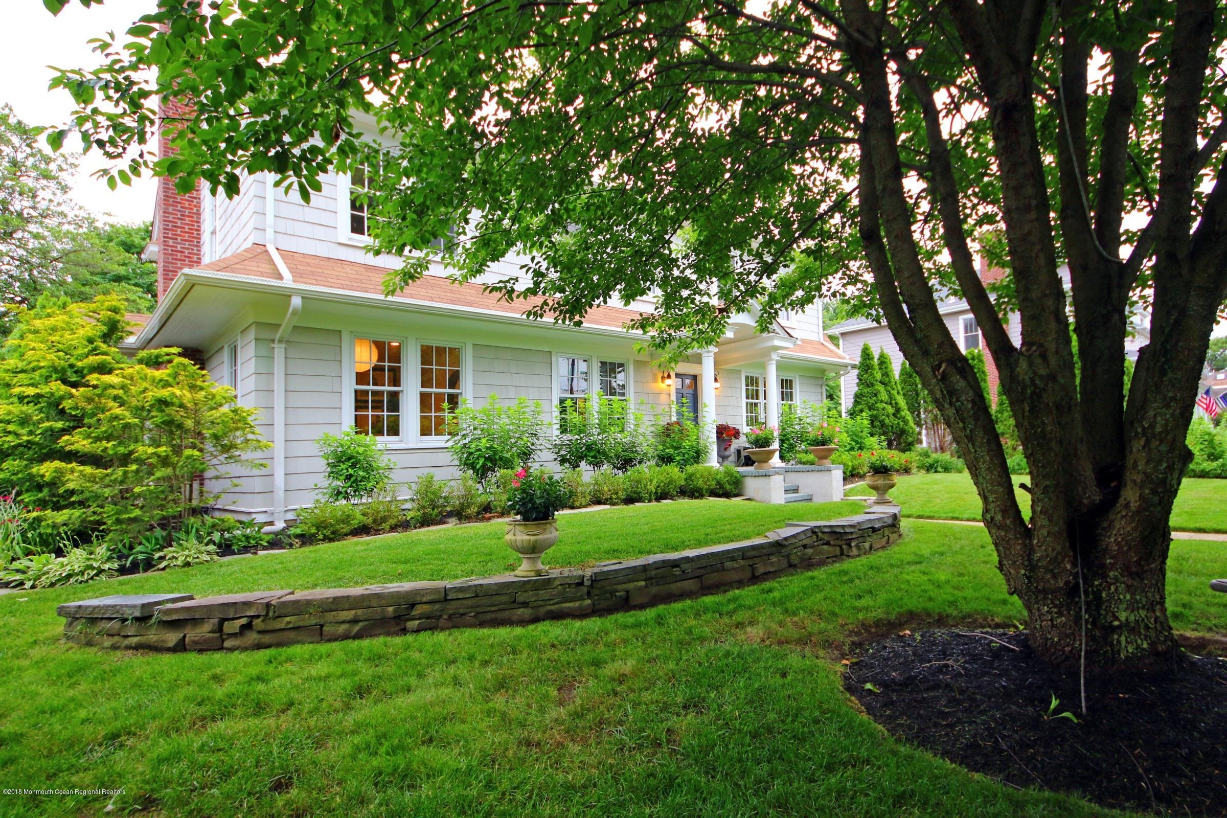 668 River Road Fair Haven, NJ 07704 - Photo 4 of 68 a front view of a house with a yard