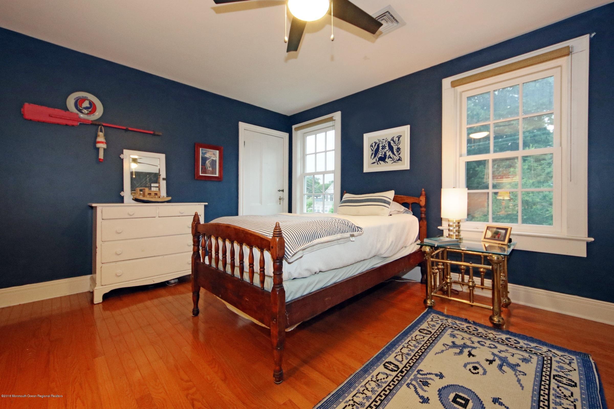 668 River Road Fair Haven, NJ 07704 - Photo 44 of 68 a bedroom with a bed and a window
