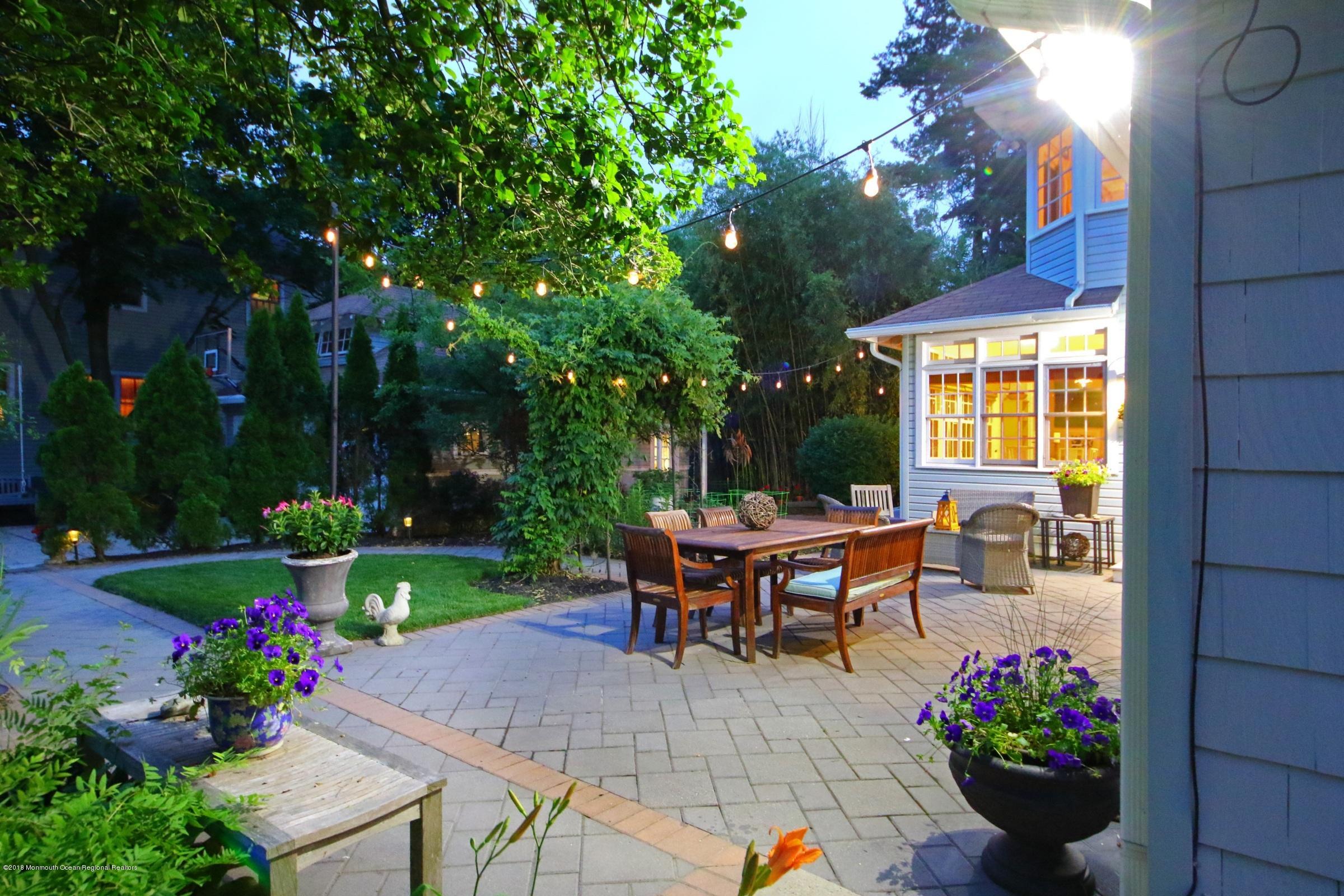 668 River Road Fair Haven, NJ 07704 - Photo 61 of 68 a view of a house with backyard and sitting area