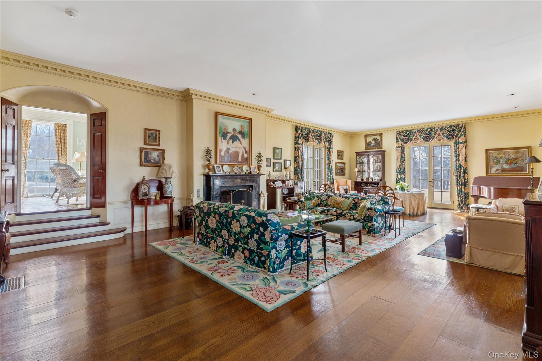 10 Lands End Road Locust Valley, NY 11560 - Photo 13 of 22 a living room with furniture wooden floor and a large window