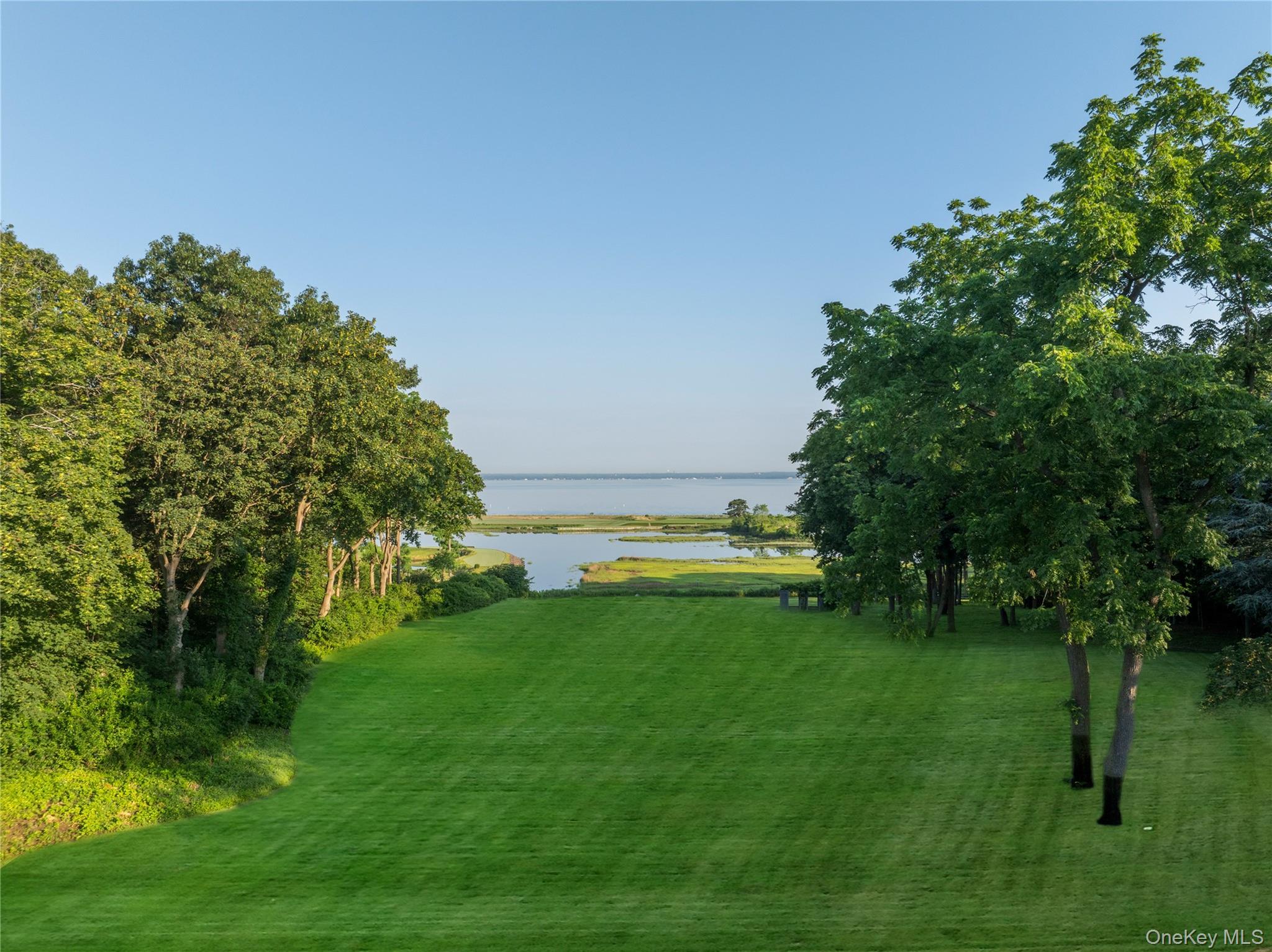 10 Lands End Road Locust Valley, NY 11560 - Photo 2 of 23 a view of yard with swimming pool and green space