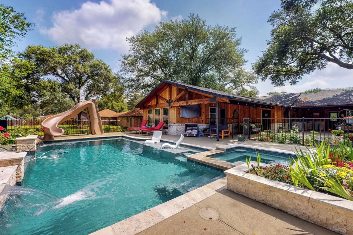 a front view of house with yard and outdoor seating