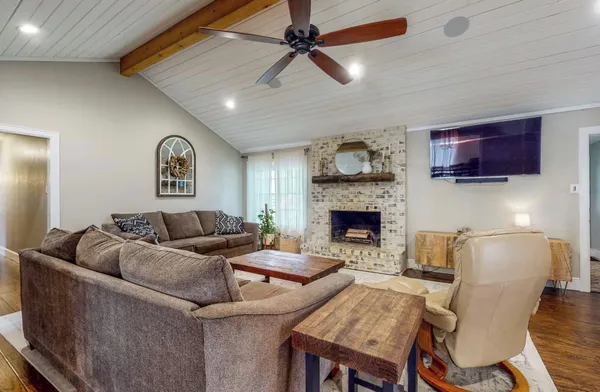 a living room with furniture and a fireplace