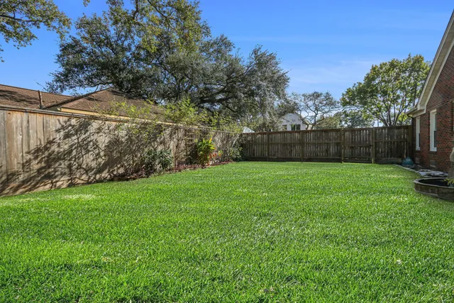 a view of backyard with green space