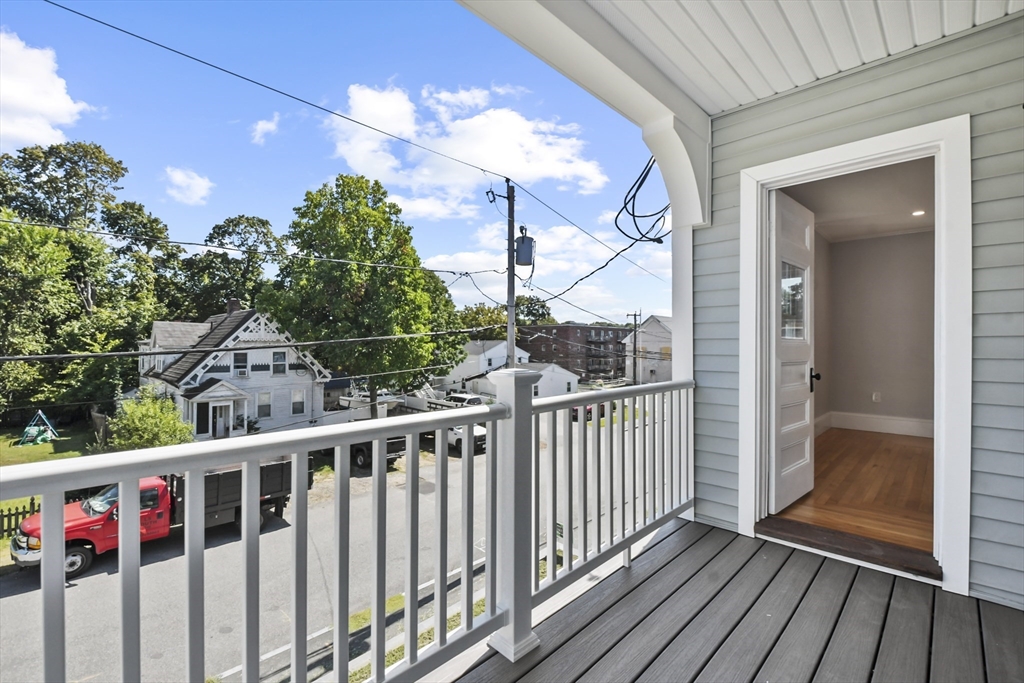 10 Cain Avenue, Unit 10 Weymouth, MA 02189 - Photo 15 of 34 a view of a balcony with wooden floor