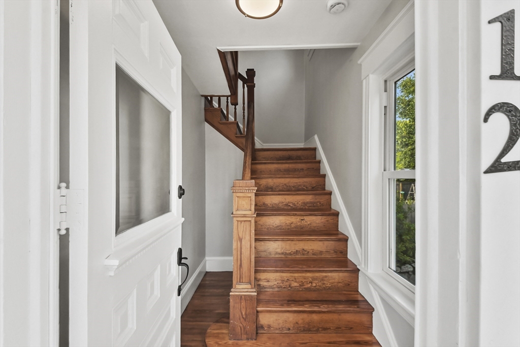 10 Cain Avenue, Unit 10 Weymouth, MA 02189 - Photo 16 of 34 a view of a hallway with wooden floor and entryway