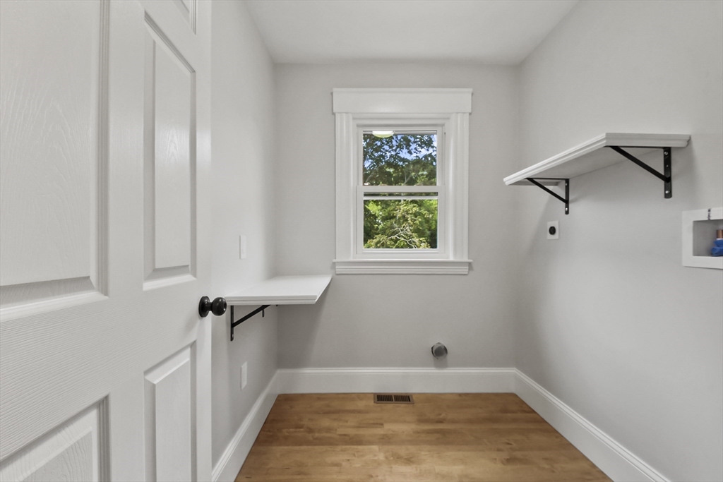 10 Cain Avenue, Unit 10 Weymouth, MA 02189 - Photo 25 of 34 a view of a room with wooden floor and a window