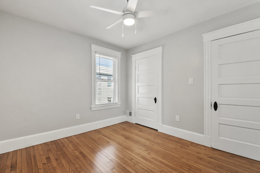 10 Cain Avenue, Unit 10 Weymouth, MA 02189 - Photo 27 of 34 wooden floor in an empty room with a window