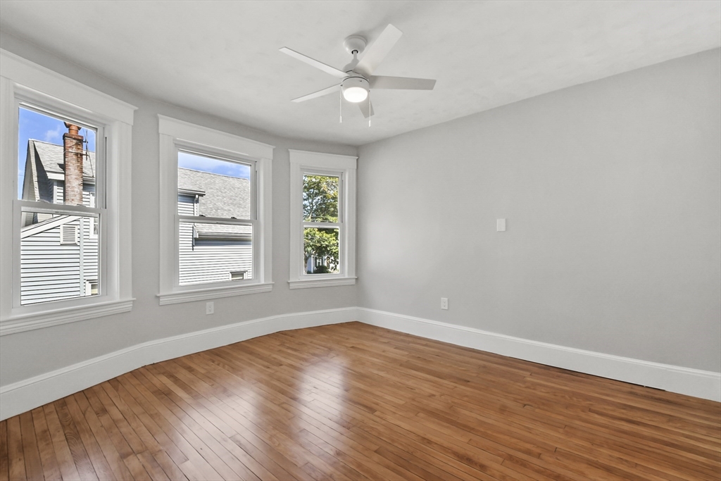 10 Cain Avenue, Unit 10 Weymouth, MA 02189 - Photo 28 of 34 wooden floor in an empty room with a window