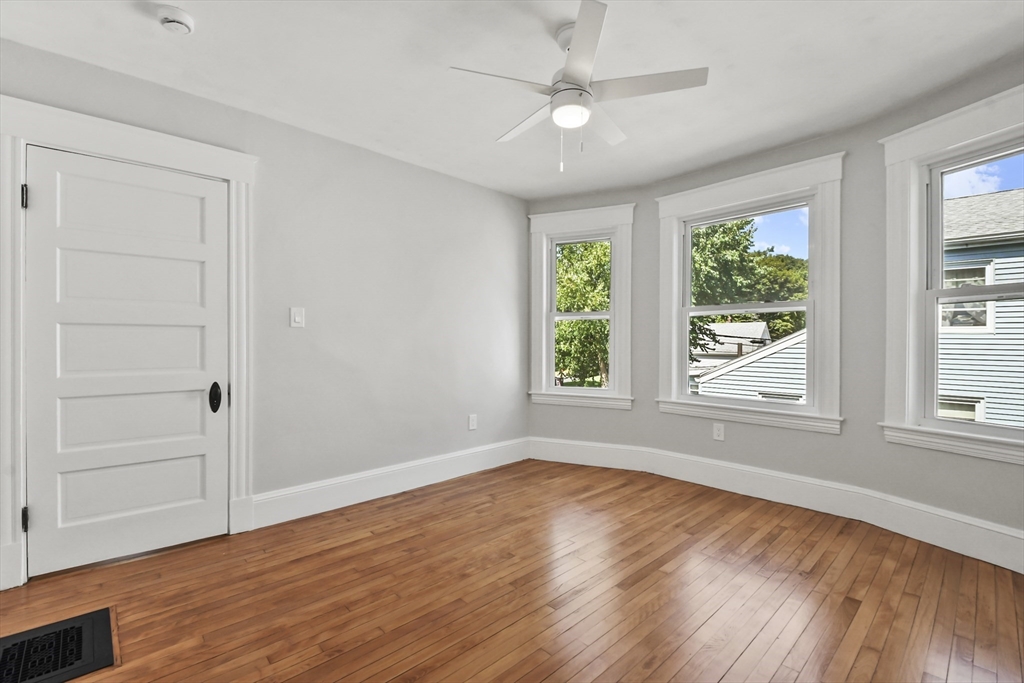 10 Cain Avenue, Unit 10 Weymouth, MA 02189 - Photo 30 of 34 wooden floor in an empty room with a window