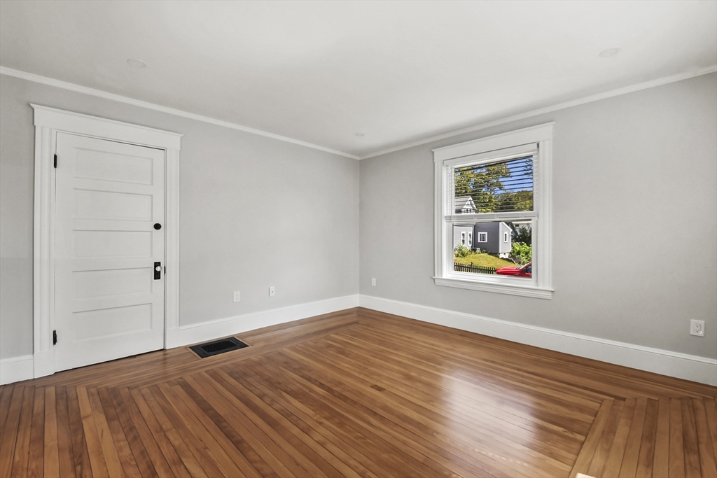 10 Cain Avenue, Unit 10 Weymouth, MA 02189 - Photo 3 of 34 an empty room with window and wooden floor