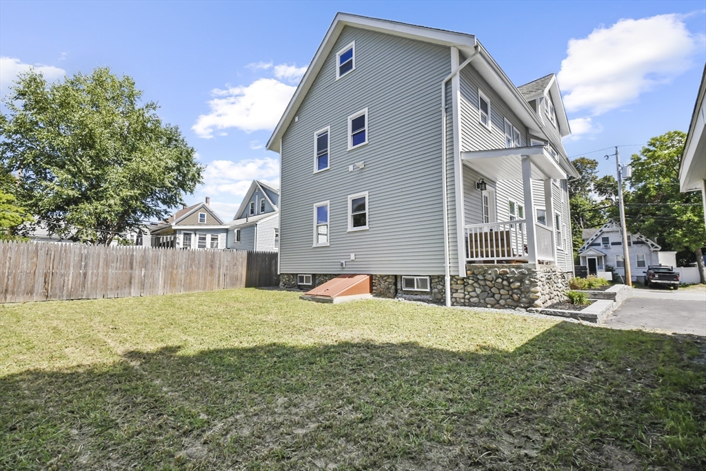 10 Cain Avenue, Unit 10 Weymouth, MA 02189 - Photo 32 of 34 a front view of a house with a yard