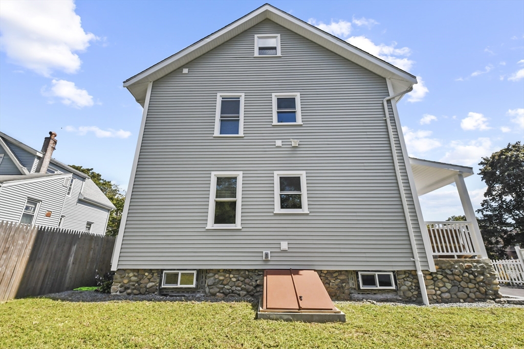 10 Cain Avenue, Unit 10 Weymouth, MA 02189 - Photo 33 of 34 a front view of a house with a yard