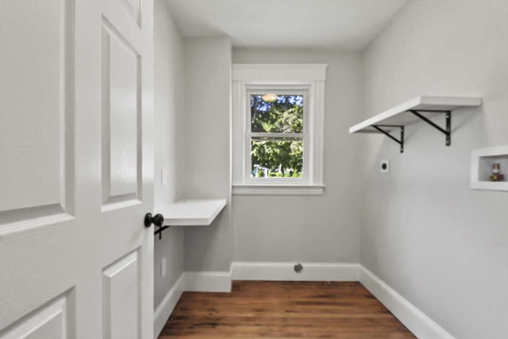 10 Cain Avenue, Unit 10 Weymouth, MA 02189 - Photo 8 of 34 a view of a room with racks on the wall