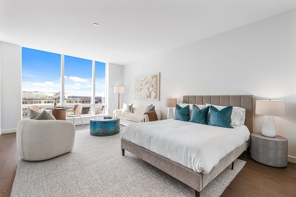 40 Trinity Place, Unit 1607 Boston, MA 02116 - Photo 2 of 36 a bedroom with bed and a large window