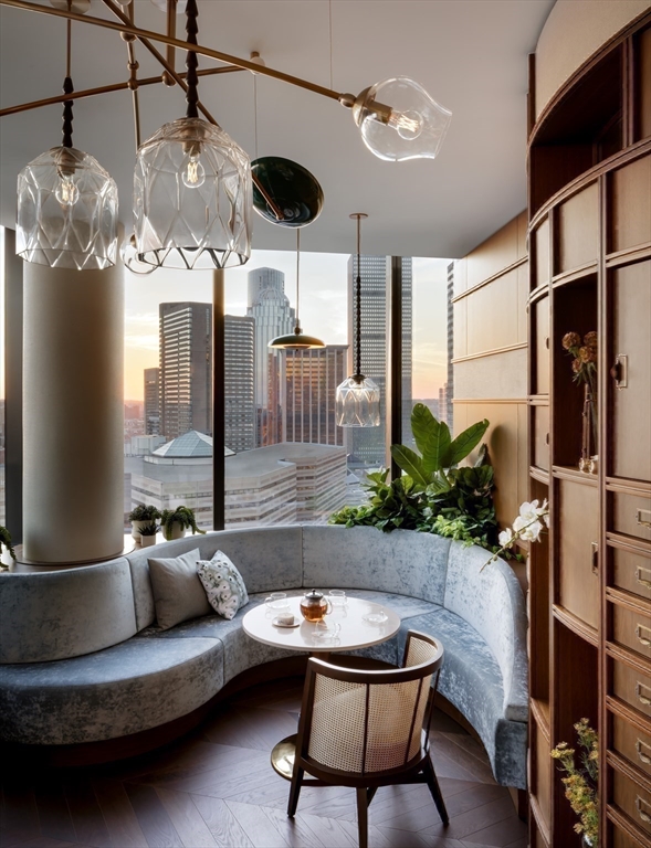 40 Trinity Place, Unit 1607 Boston, MA 02116 - Photo 26 of 36 a living room with furniture and a chandelier