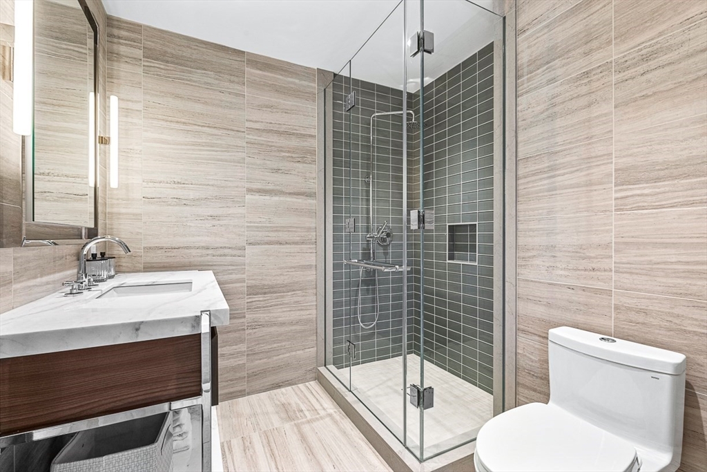 40 Trinity Place, Unit 1607 Boston, MA 02116 - Photo 8 of 36 a bathroom with a sink toilet and shower