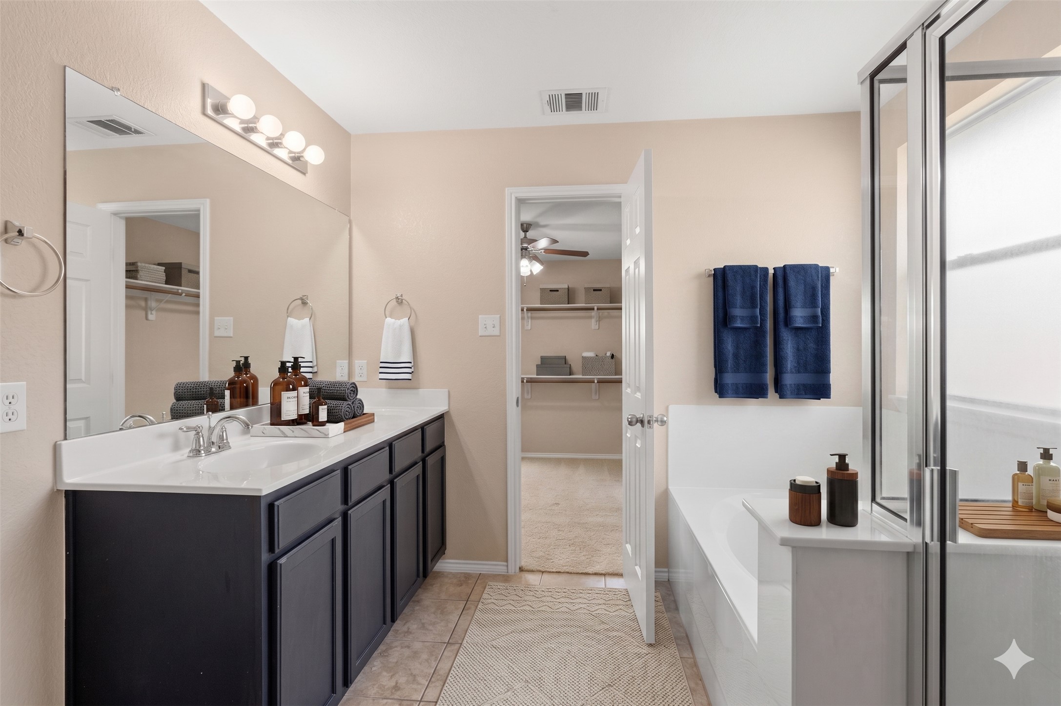 20224 Merlin Falcon Trail Pflugerville, TX 78660 - Photo 7 of 40 A bright bathroom with a spacious vanity and a walk-in shower offers a relaxing retreat.