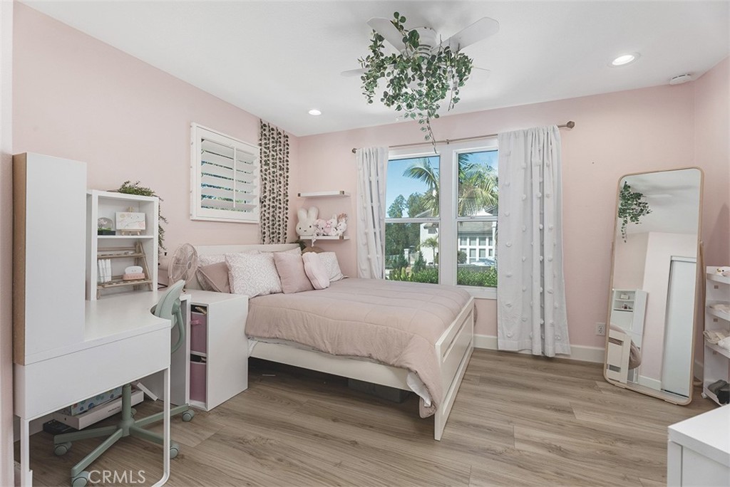 90 Cameray Heights Laguna Niguel, CA 92677 - Photo 21 of 36 a room with a bed and a chandelier