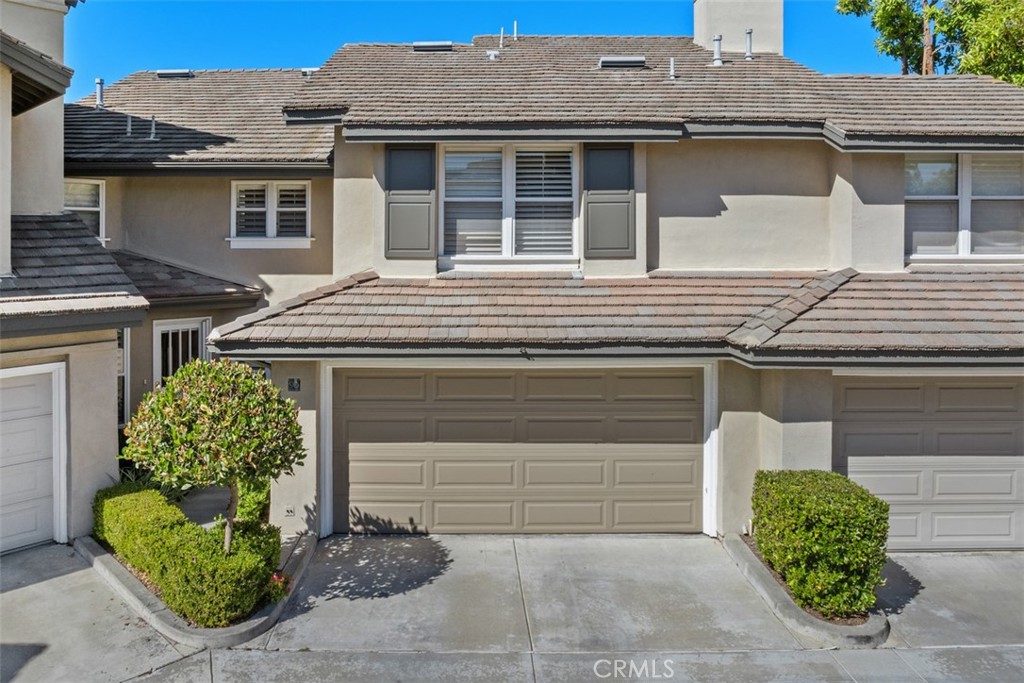 90 Cameray Heights Laguna Niguel, CA 92677 - Photo 26 of 36 a front view of a house with garden