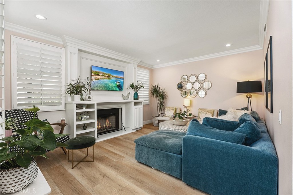 90 Cameray Heights Laguna Niguel, CA 92677 - Photo 5 of 36 a living room with furniture a flat screen tv and a fireplace