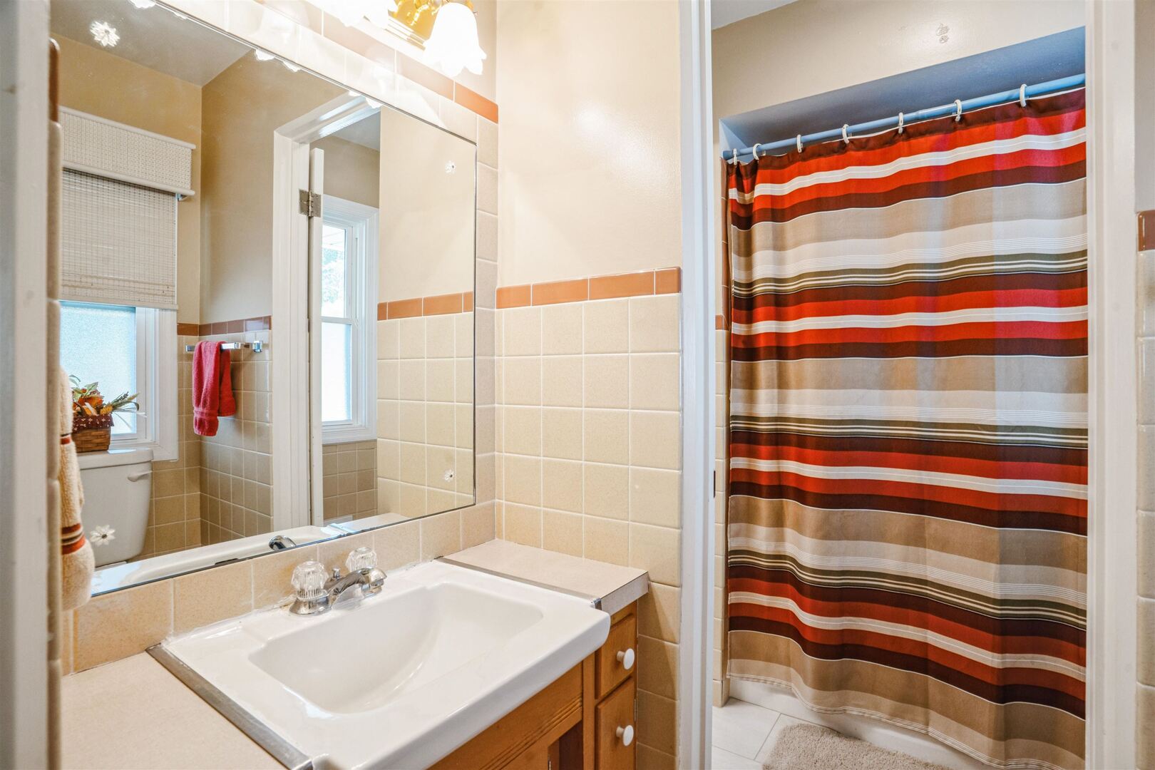 3431 37th Avenue Rock Island, IL 61201 - Photo 14 of 25 a bathroom with a sink and a mirror
