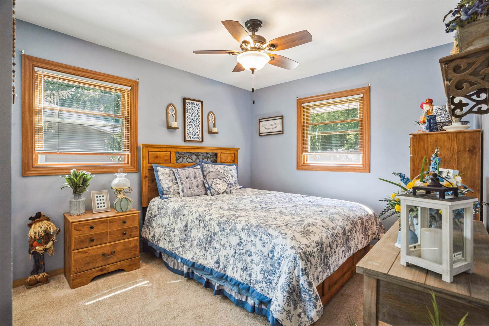 3431 37th Avenue Rock Island, IL 61201 - Photo 15 of 25 a bedroom with a bed and a chandelier