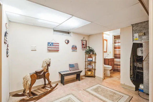 a view of a livingroom with furniture and an empty room