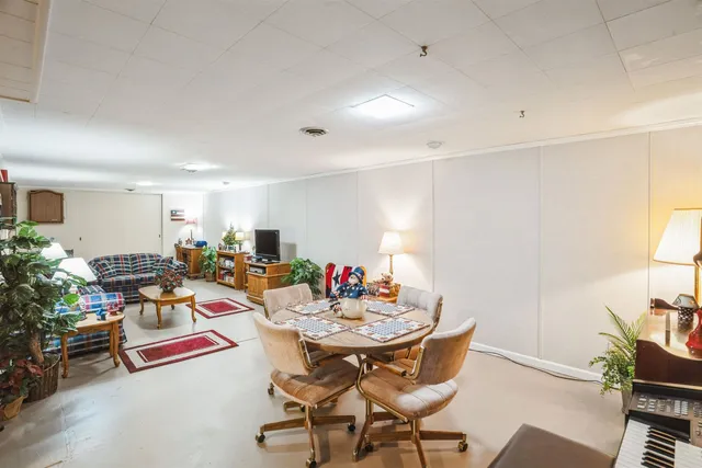 a view of a dining room with furniture and a livingroom