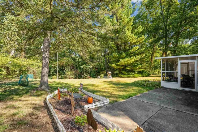 a view of a backyard with sitting area