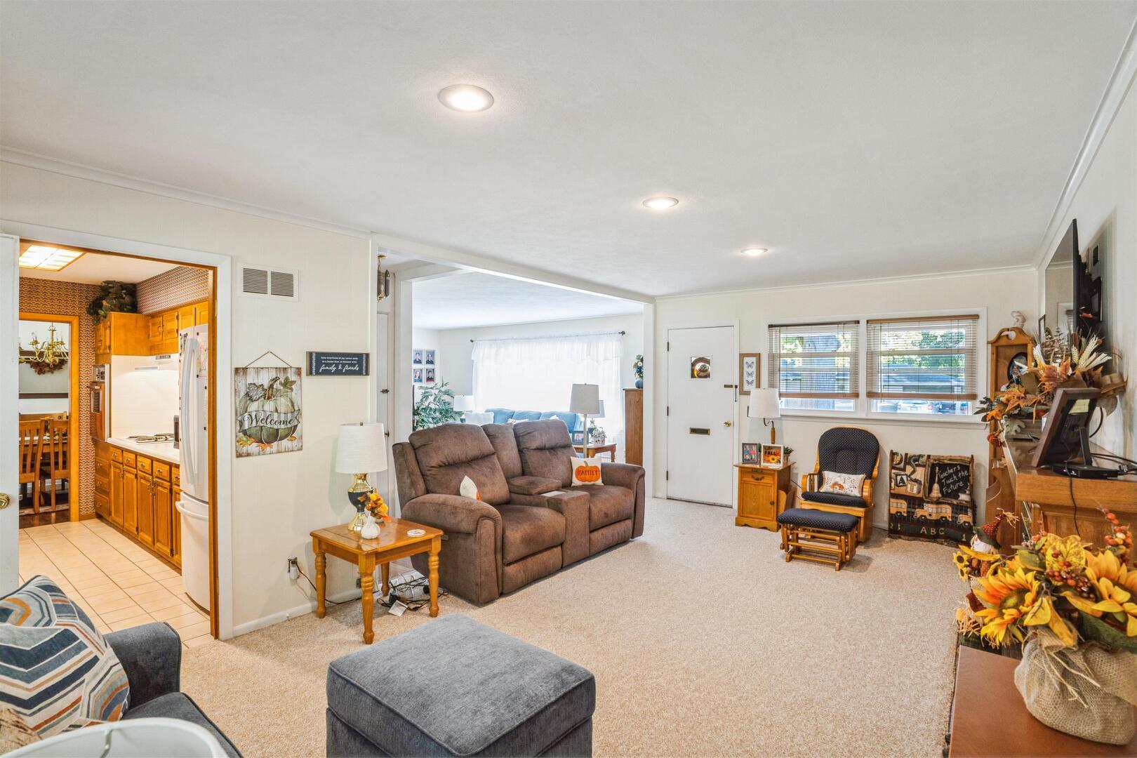 3431 37th Avenue Rock Island, IL 61201 - Photo 6 of 25 a living room with furniture and a flat screen tv
