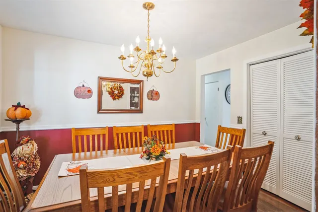 a bed room with a bed and a chandelier